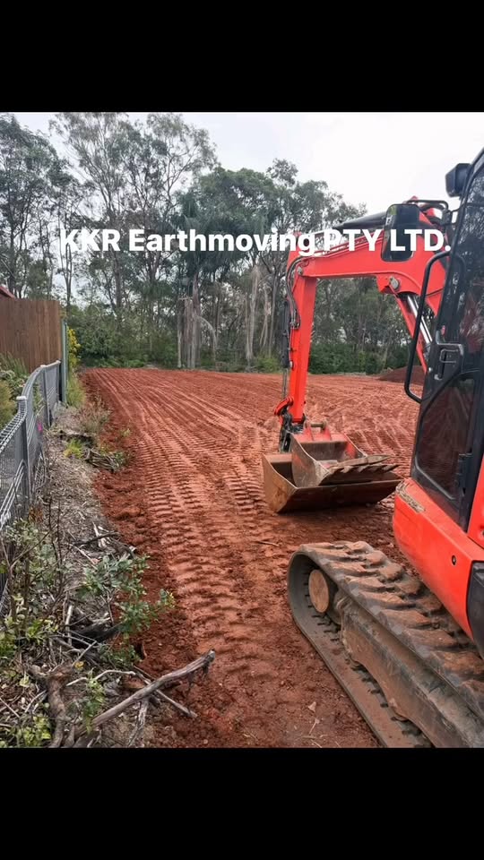 Red excavator on a prepared earthworks site, from a KKR Facebook reel